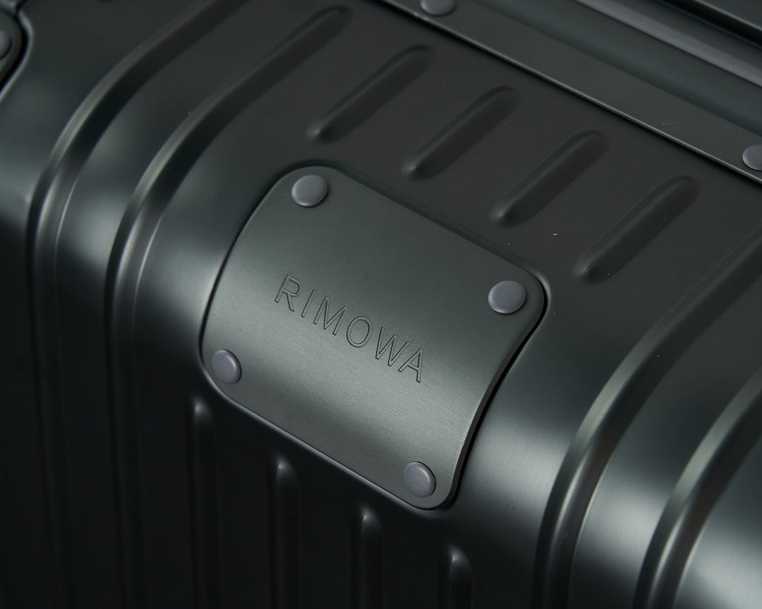 Sleek Black Ribbed Hardshell Carry-On Suitcase with Spinner Wheels