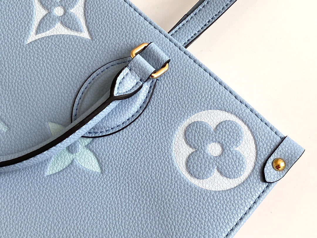 Louis Vuitton OnTheGo MM Monogram Empreinte Leather Tote Bag - Light Blue