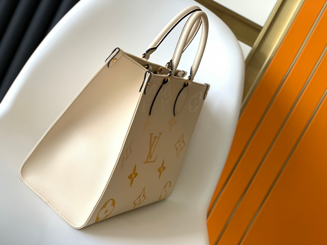 Louis Vuitton OnTheGo MM Monogram Empreinte Leather Tote Bag - Cream/Yellow
