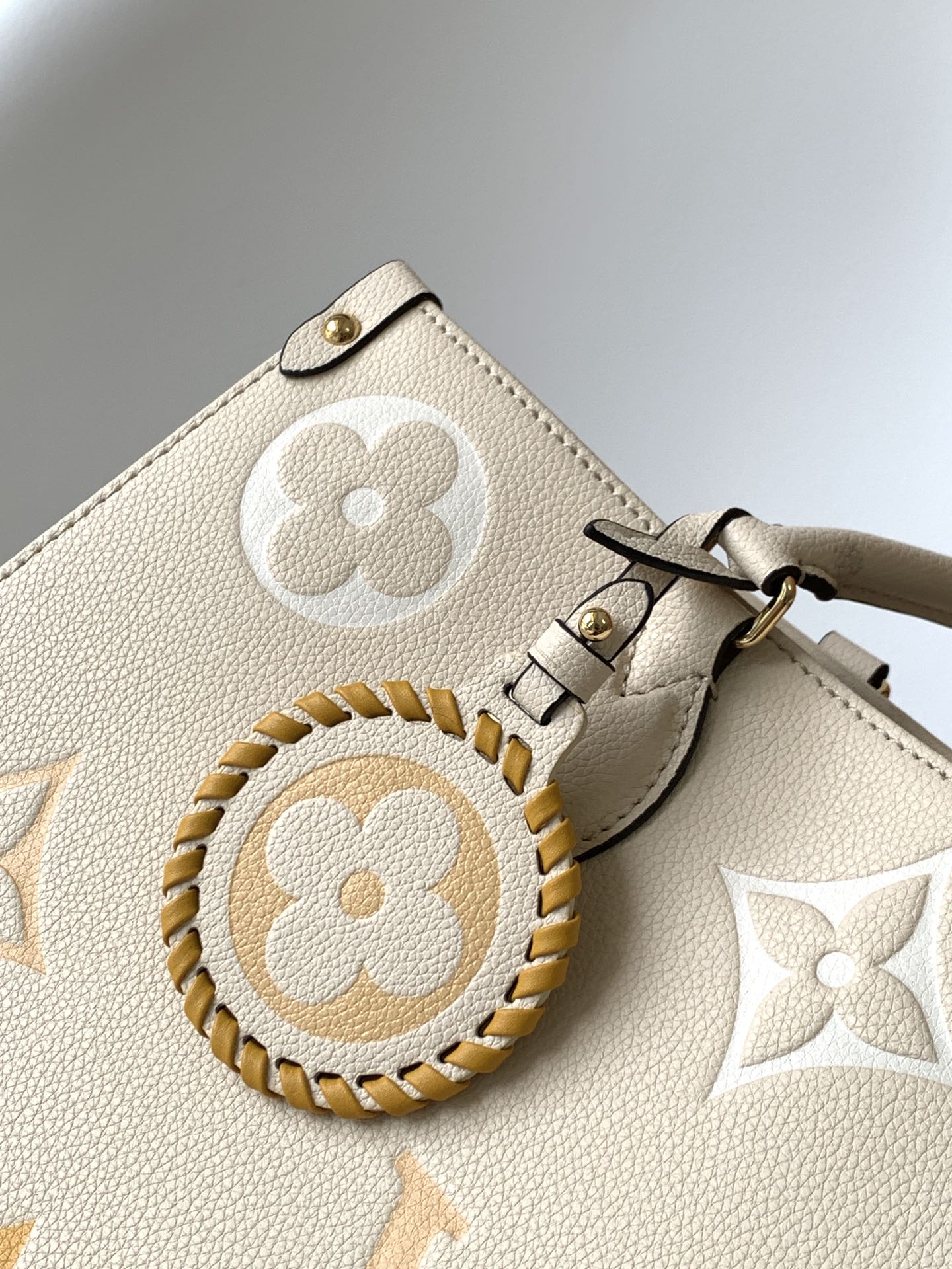 Louis Vuitton OnTheGo MM Monogram Empreinte Leather Tote Bag - Cream/Yellow