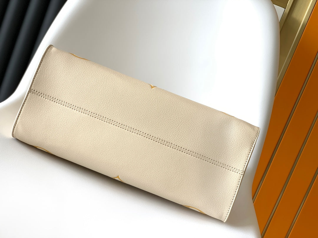 Louis Vuitton OnTheGo MM Monogram Empreinte Leather Tote Bag - Cream/Yellow