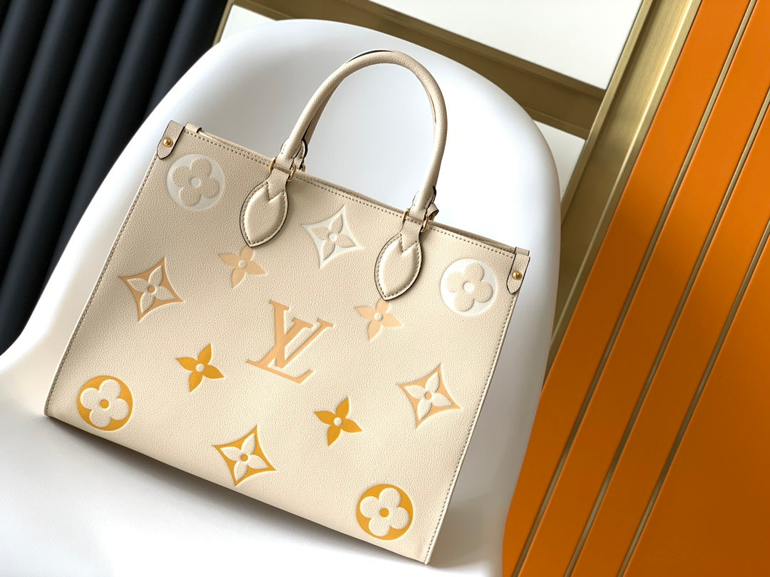 Louis Vuitton OnTheGo MM Monogram Empreinte Leather Tote Bag - Cream/Yellow