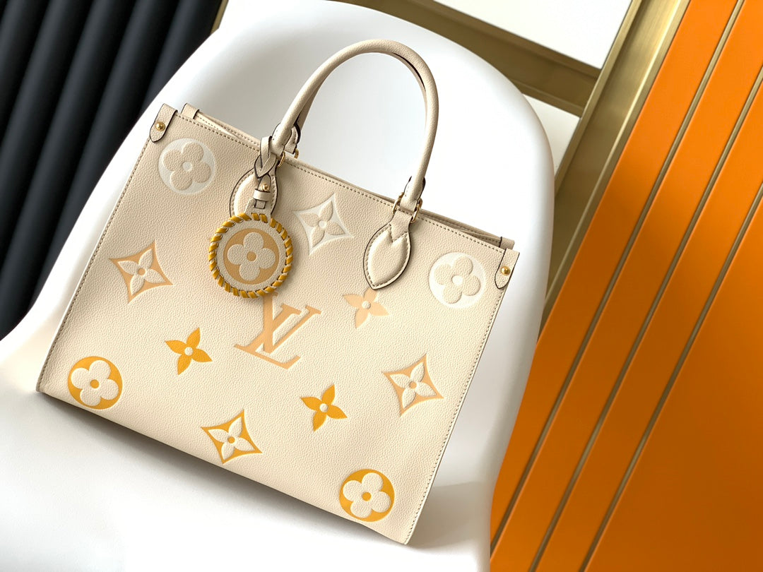 Louis Vuitton OnTheGo MM Monogram Empreinte Leather Tote Bag - Cream/Yellow
