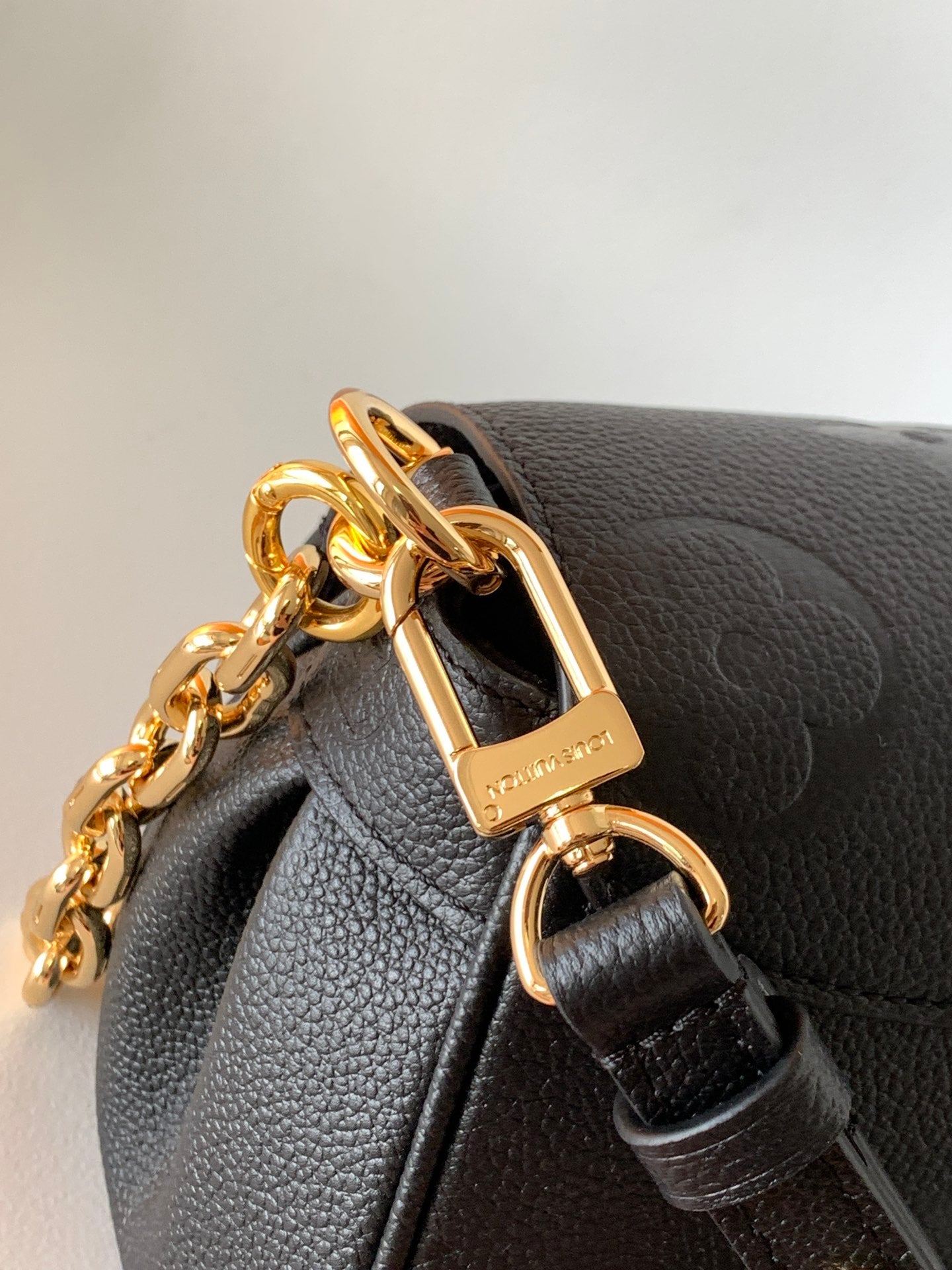 Louis Vuitton Elegant Black Embossed Leather Flap Bag with Gold Chain