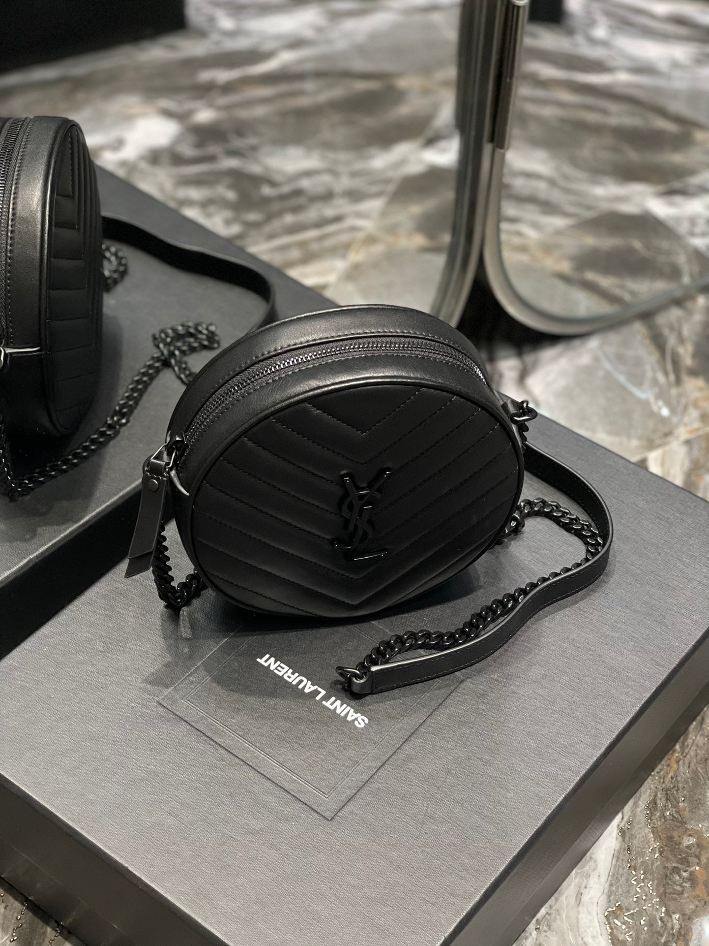 Saint Laurent Vinyle Round Camera Bag in Chevron-Quilted Leather - Black