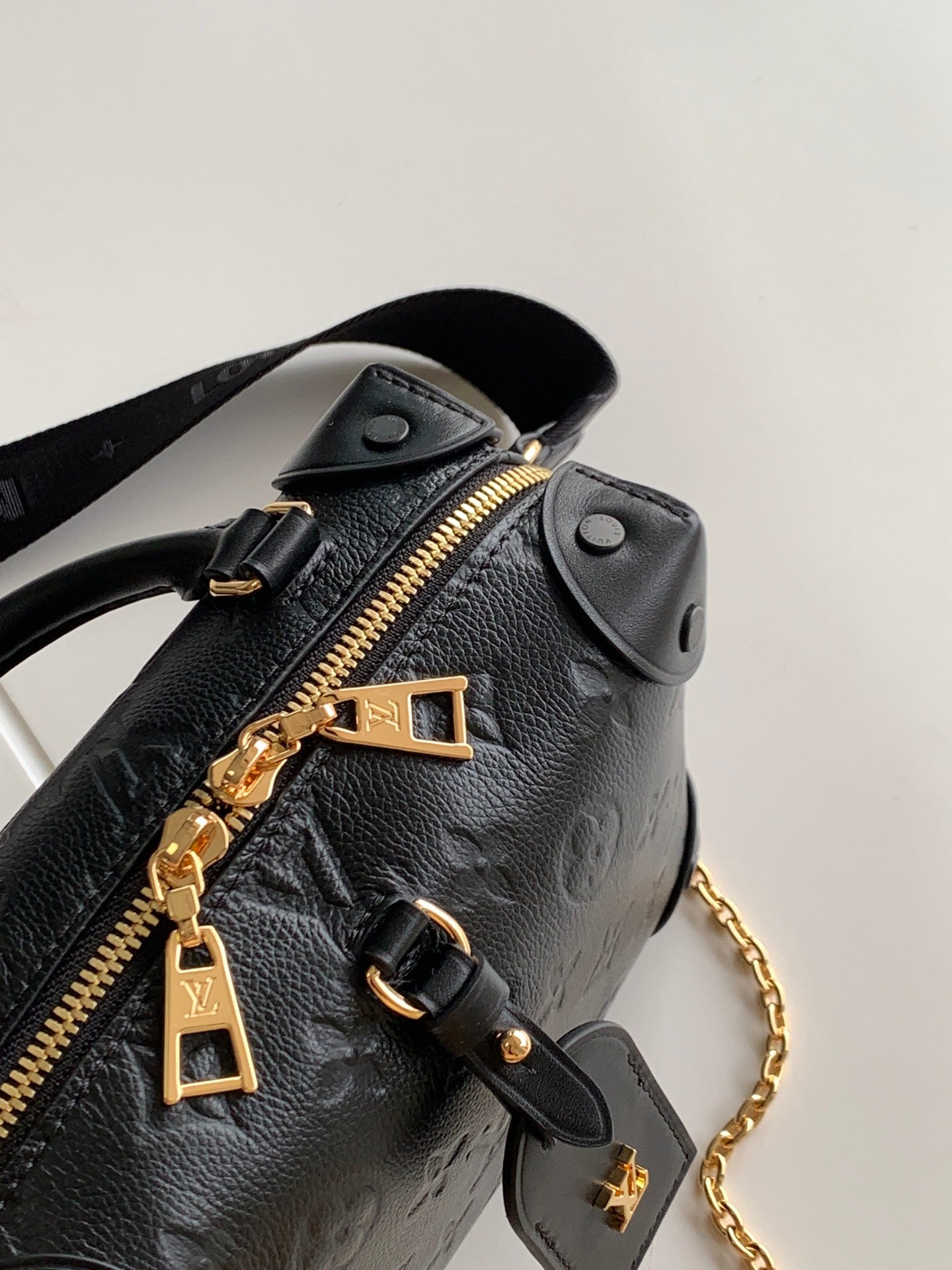 Louis Vuitton Black Embossed Crossbody Handbag with Wide Strap and Gold Chain