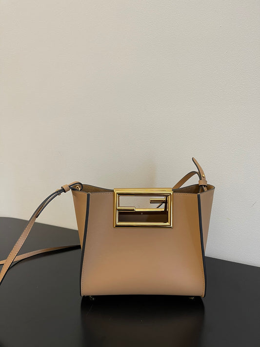 Tan Leather Bucket Bag with Gold Geometric Clasp and Shoulder Strap