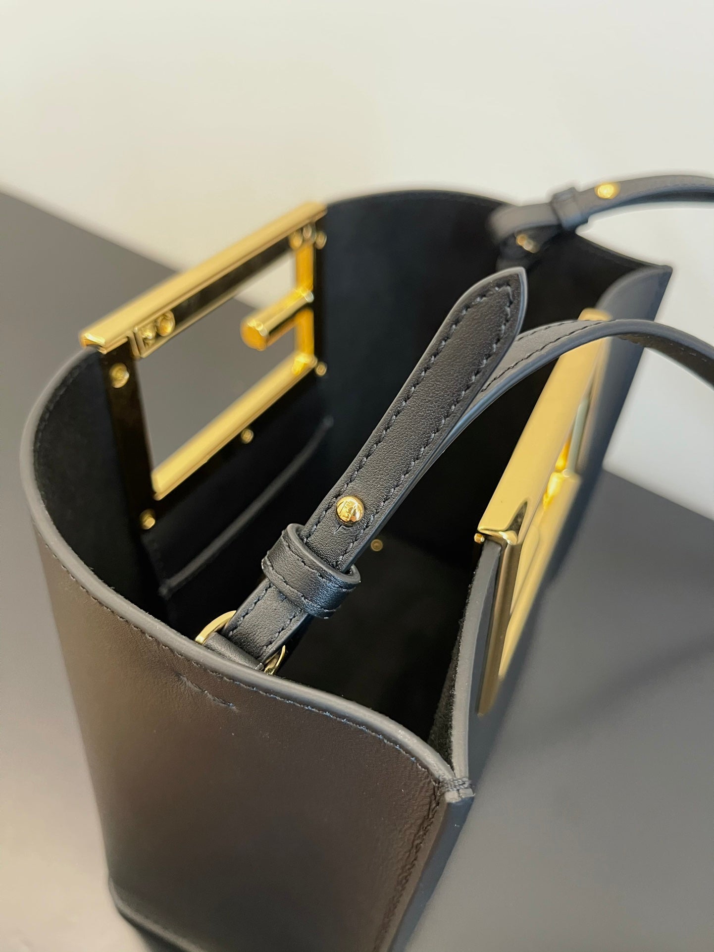 Luxury Black Leather Mini Bucket Shoulder Bag with Gold Metal Logo Buckle
