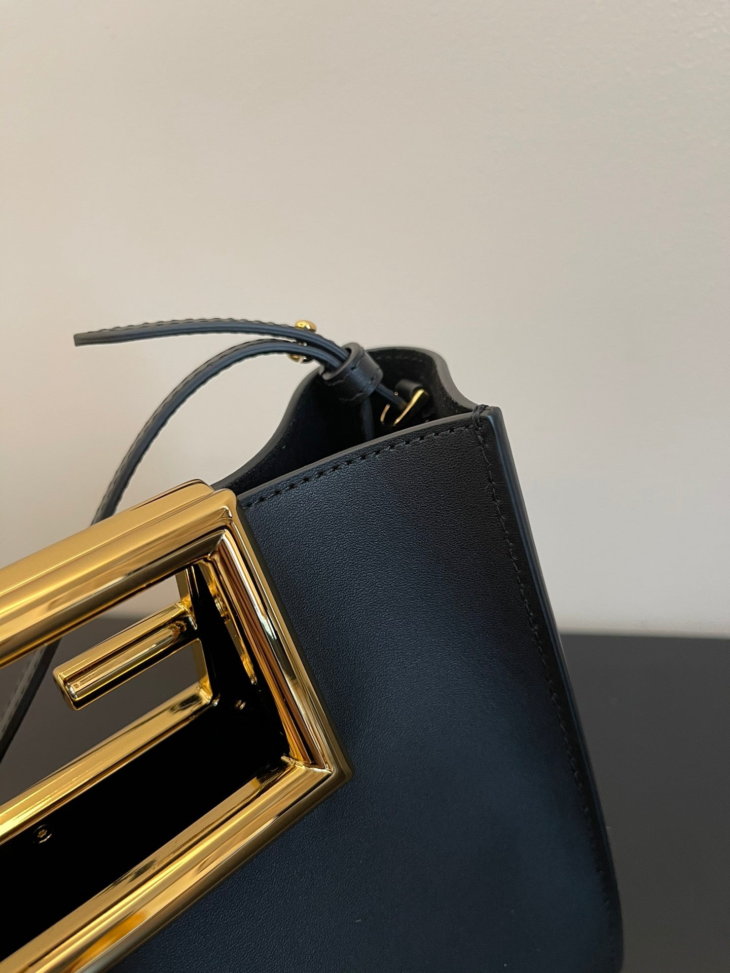 Luxury Black Leather Mini Bucket Shoulder Bag with Gold Metal Logo Buckle