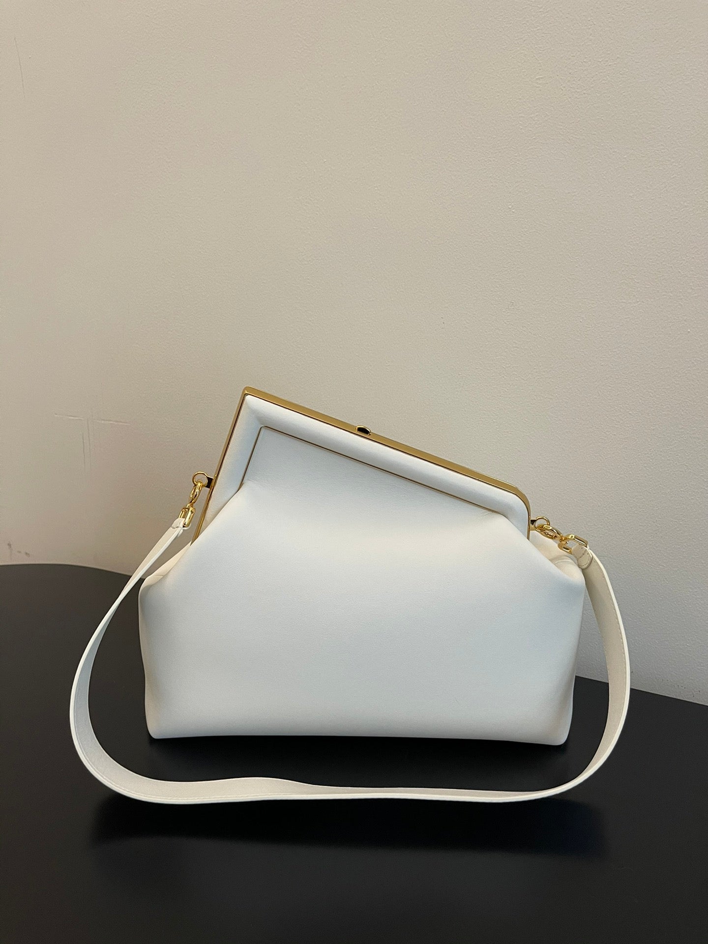 Elegant White Leather Clutch Bag with Unique F-Shaped Frame and Detachable Shoulder Strap