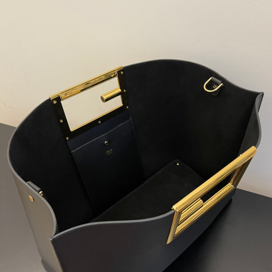Elegant Black Leather Handbag with Gold Rectangular Clasp and Detachable Shoulder Strap