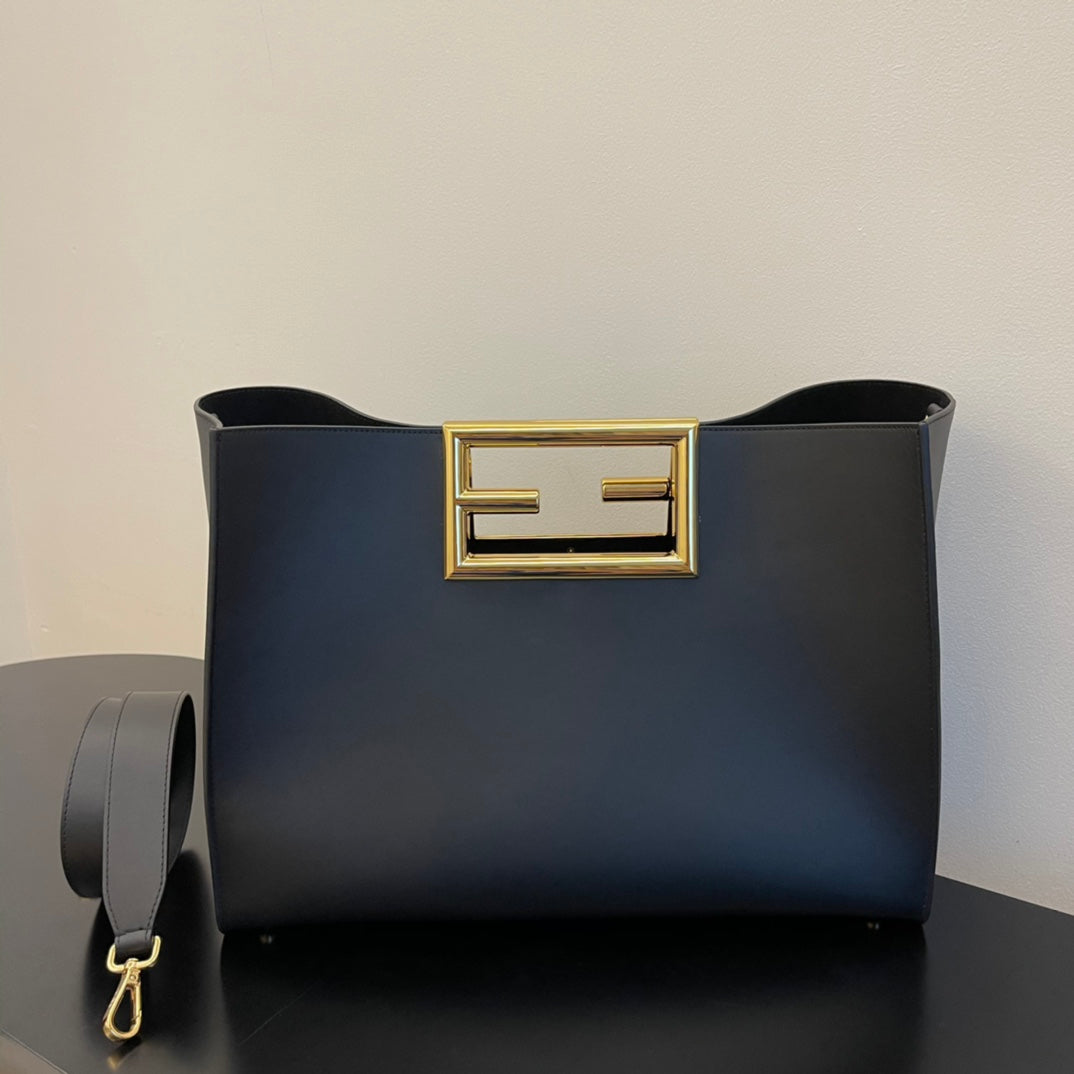 Elegant Black Leather Handbag with Gold Rectangular Clasp and Detachable Shoulder Strap