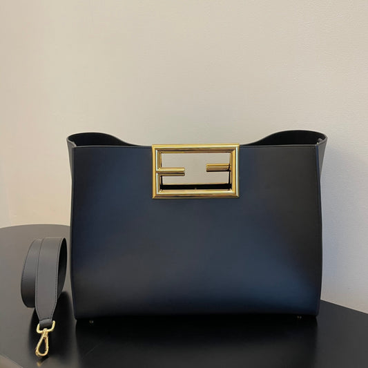 Elegant Black Leather Handbag with Gold Rectangular Clasp and Detachable Shoulder Strap