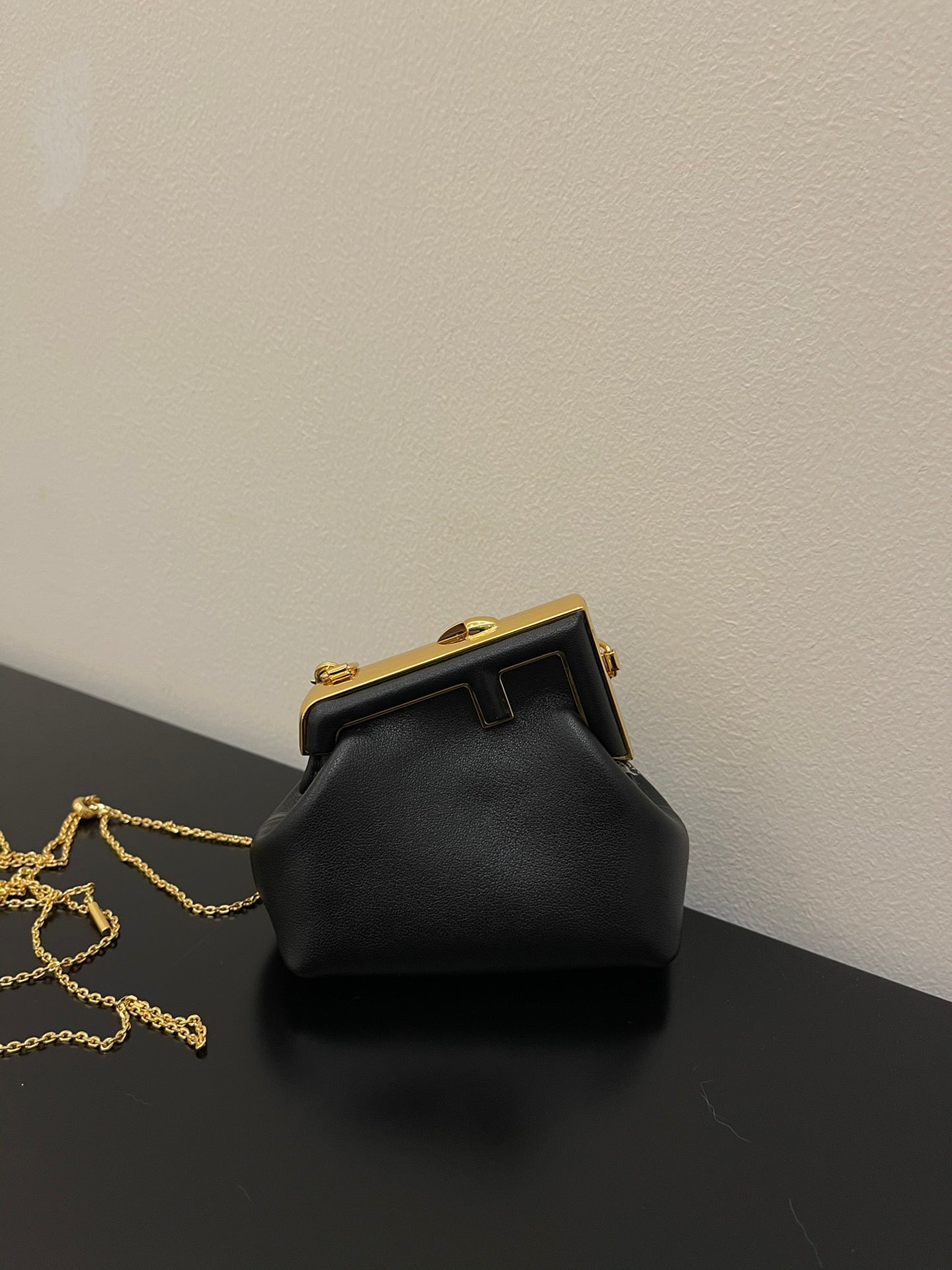 Fendi First Nano Black Nappa Leather Bag with Gold Chain Strap