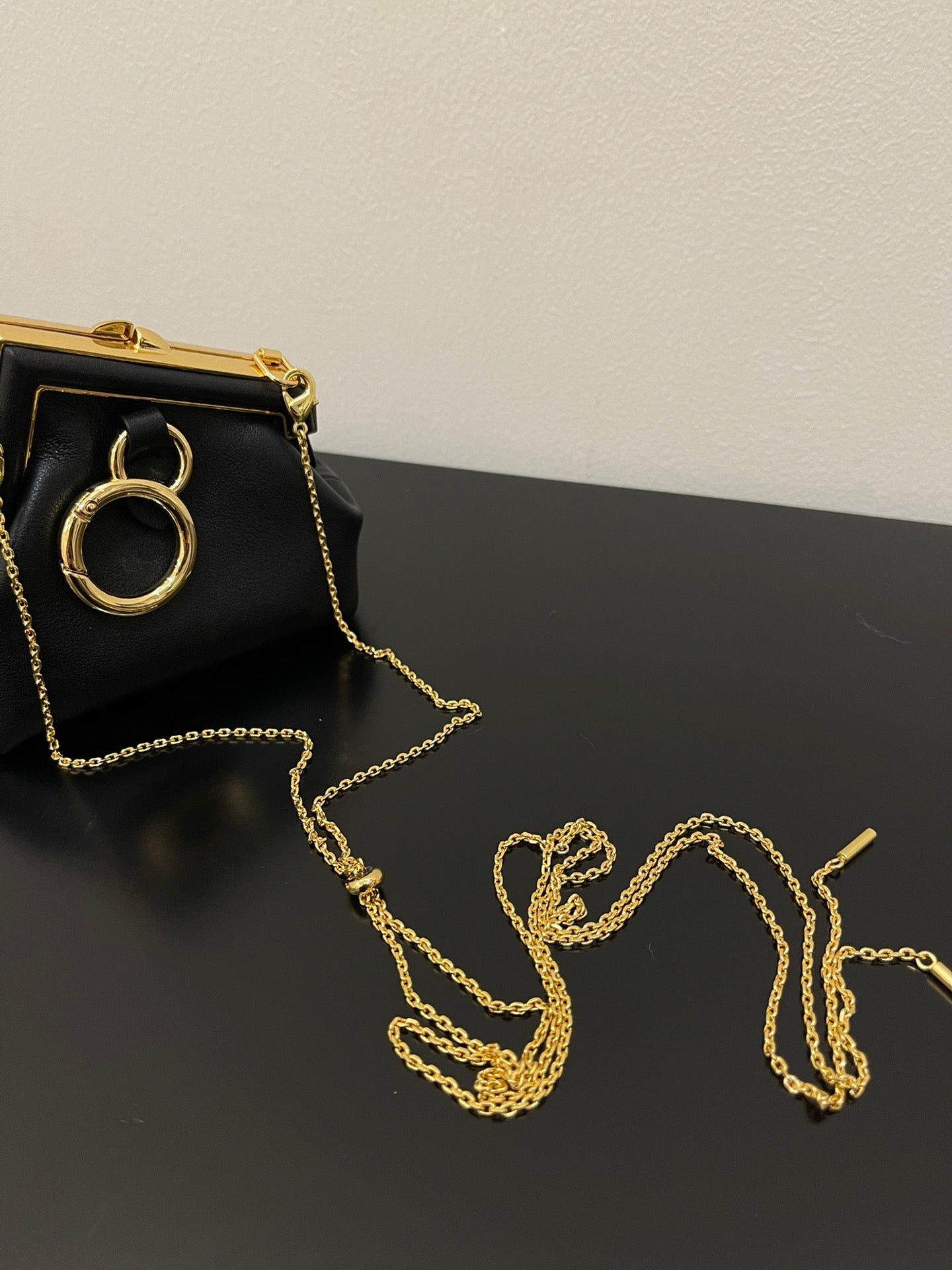 Fendi First Nano Black Nappa Leather Bag with Gold Chain Strap
