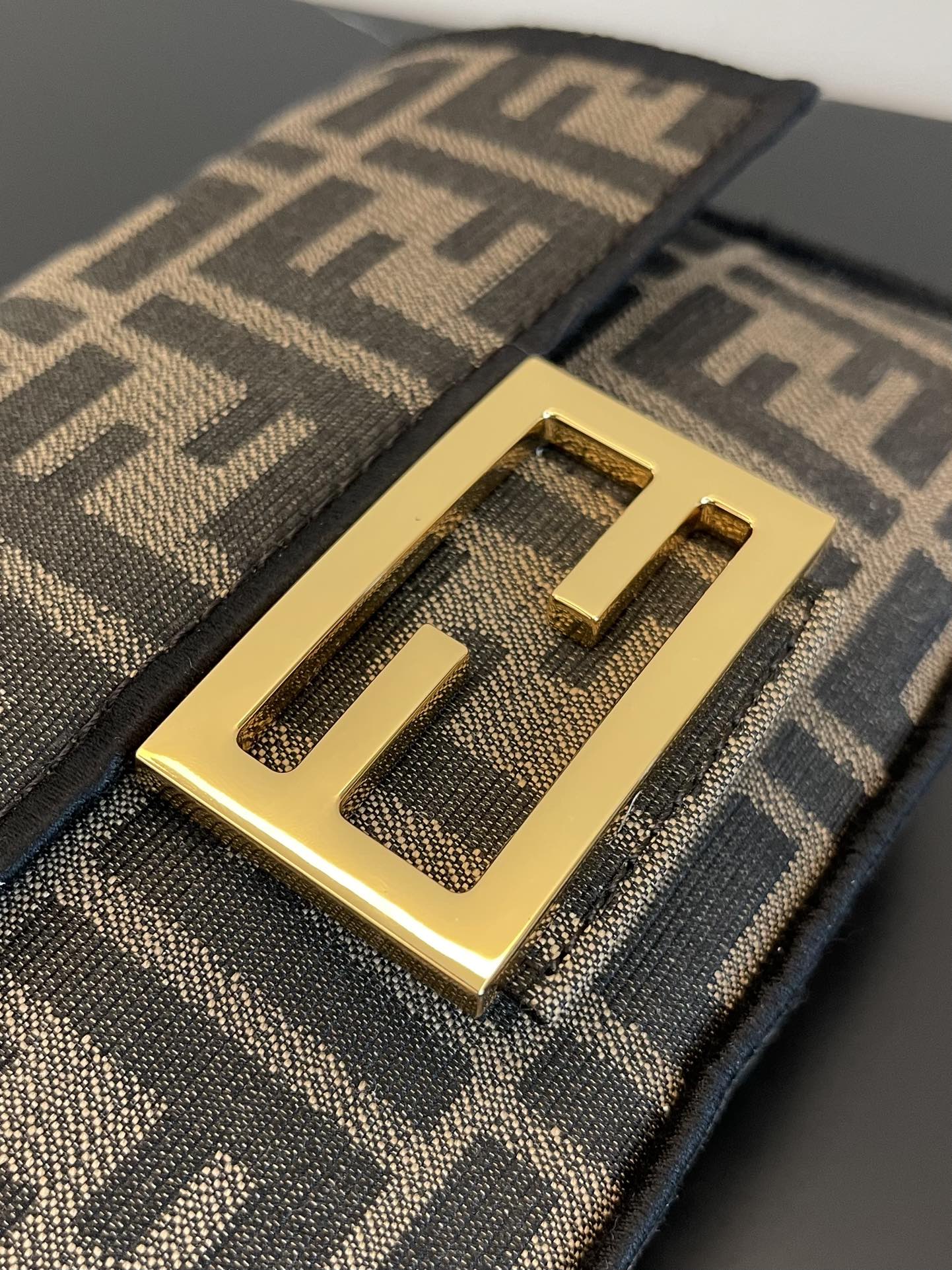 Fendi Mini Baguette Bag in Iconic FF Logo Canvas with Gold-Tone Hardware