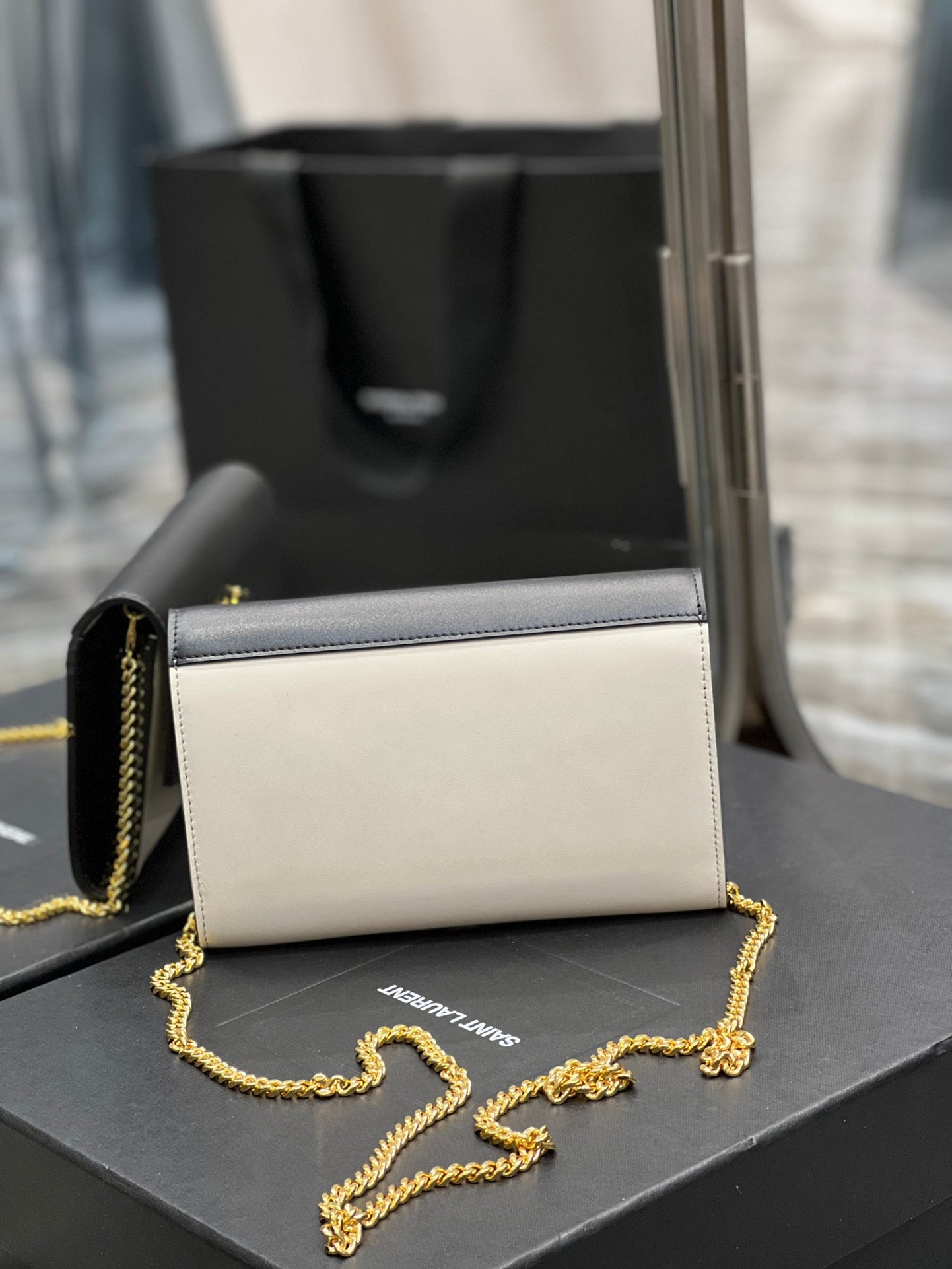 Saint Laurent Uptown Chain Wallet in Black and White Leather