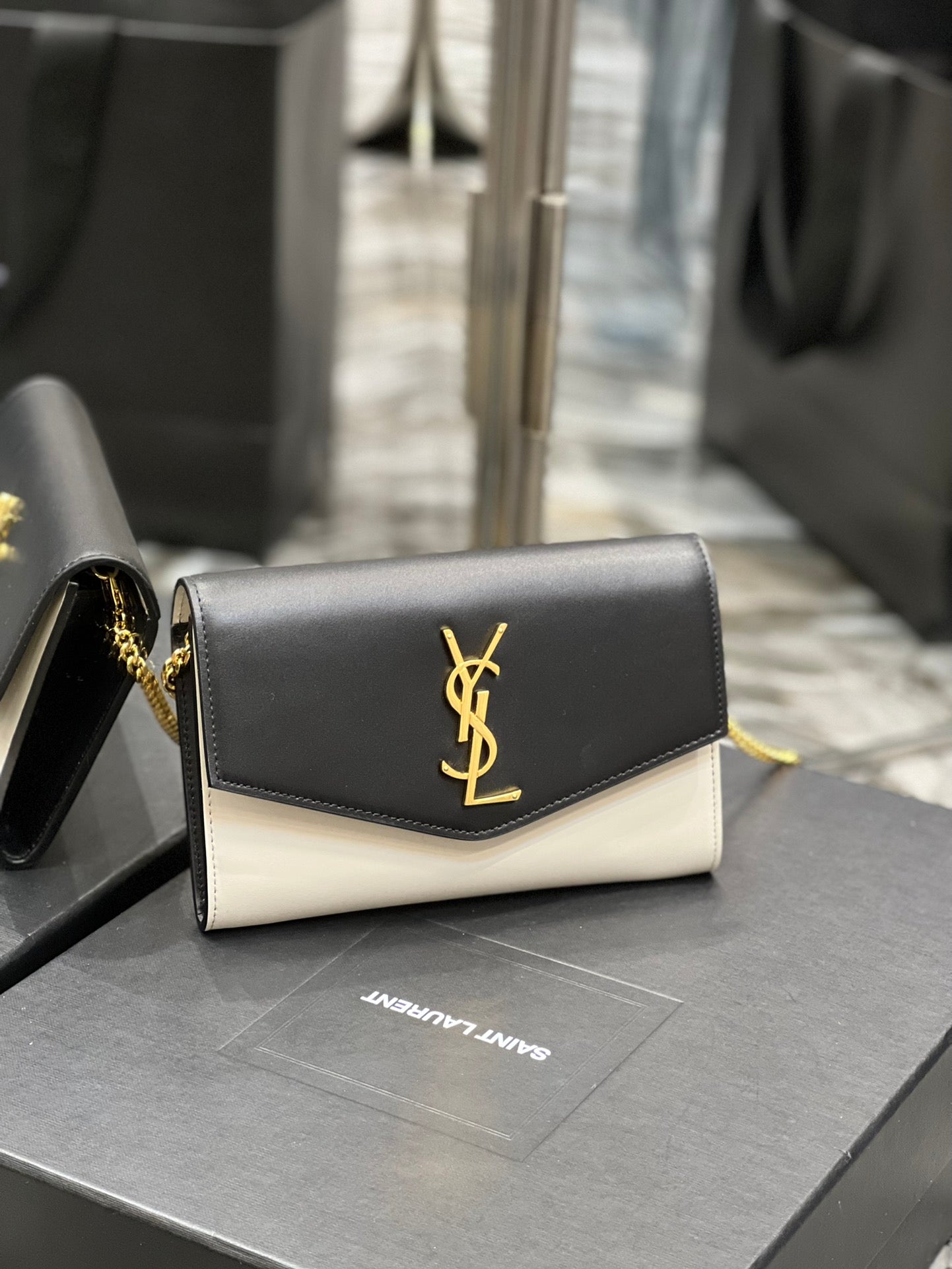 Saint Laurent Uptown Chain Wallet in Black and White Leather