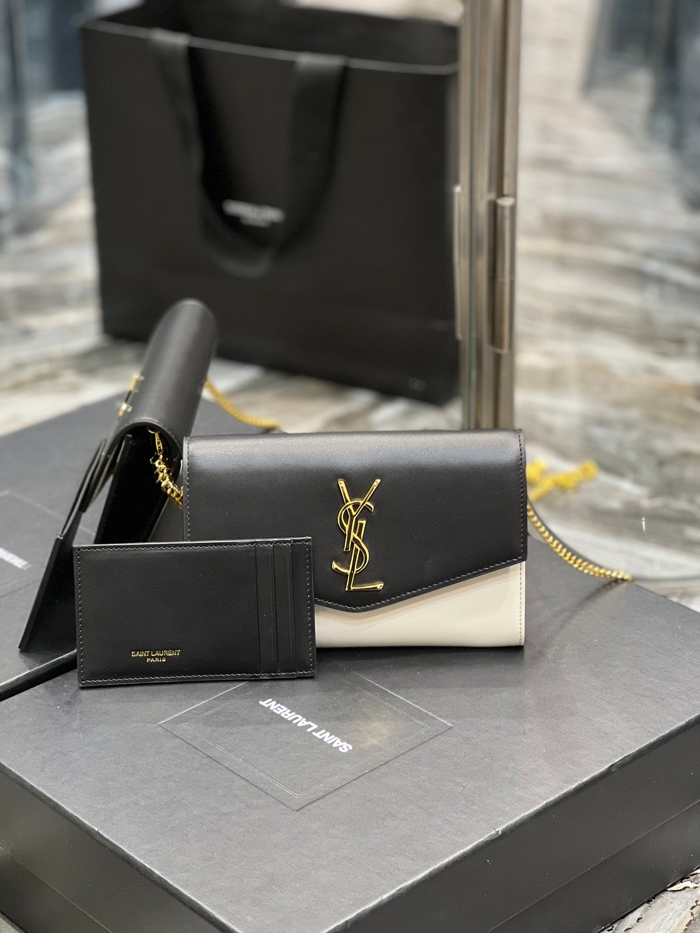 Saint Laurent Uptown Chain Wallet in Black and White Leather