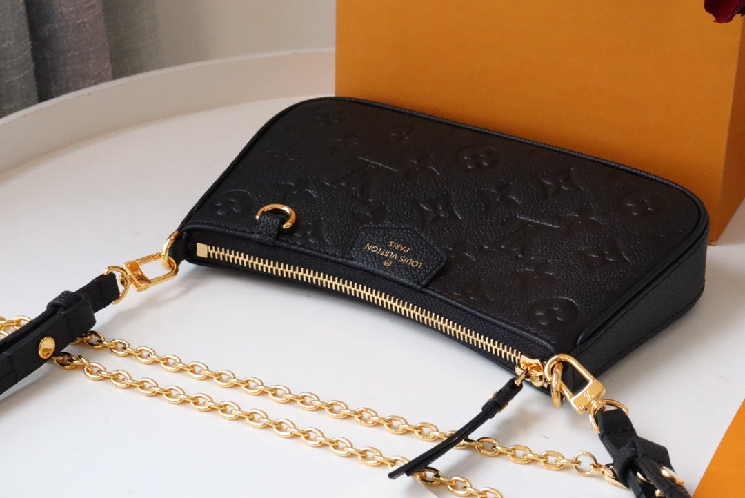 Louis Vuitton Monogram Empreinte Leather Pochette Accessoires - Black