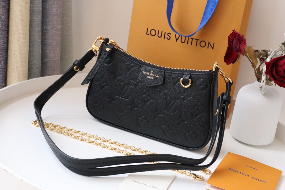 Louis Vuitton Monogram Empreinte Leather Pochette Accessoires - Black