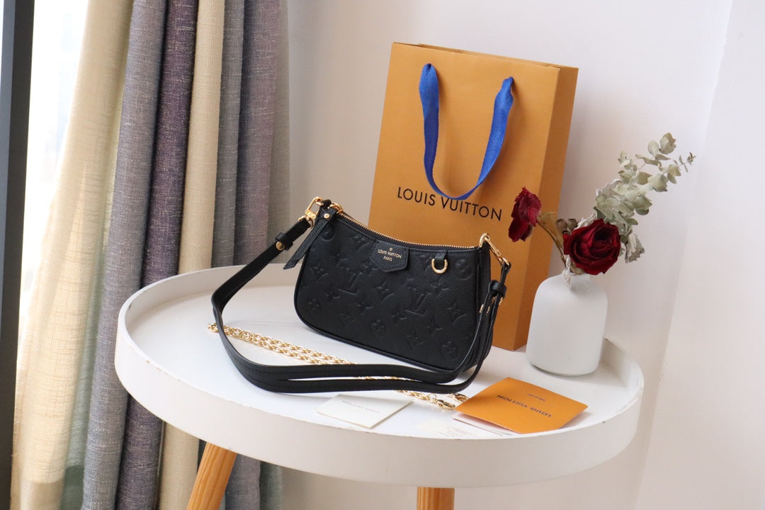 Louis Vuitton Monogram Empreinte Leather Pochette Accessoires - Black
