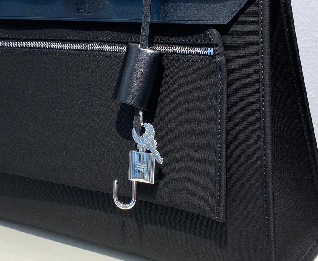 Elegant Black Structured Top-Handle Handbag - Versatile Satchel with Shoulder Strap