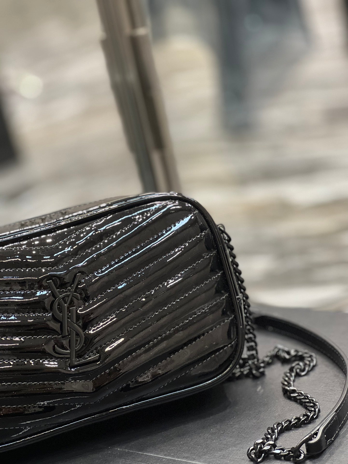 Quilted Black Patent Leather Crossbody Camera Bag with Tassel and Chain Strap