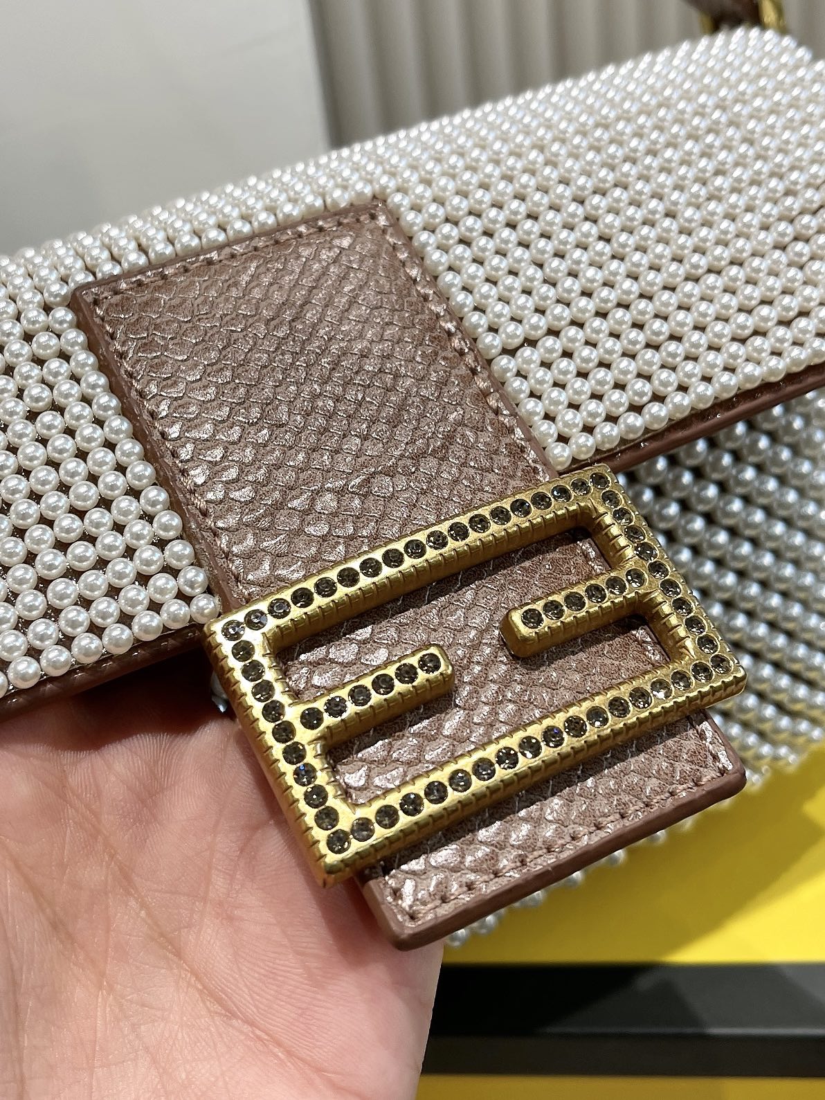 Elegant Textured Weave Baguette Shoulder Bag with Gold-Tone Buckle - Cream and Black