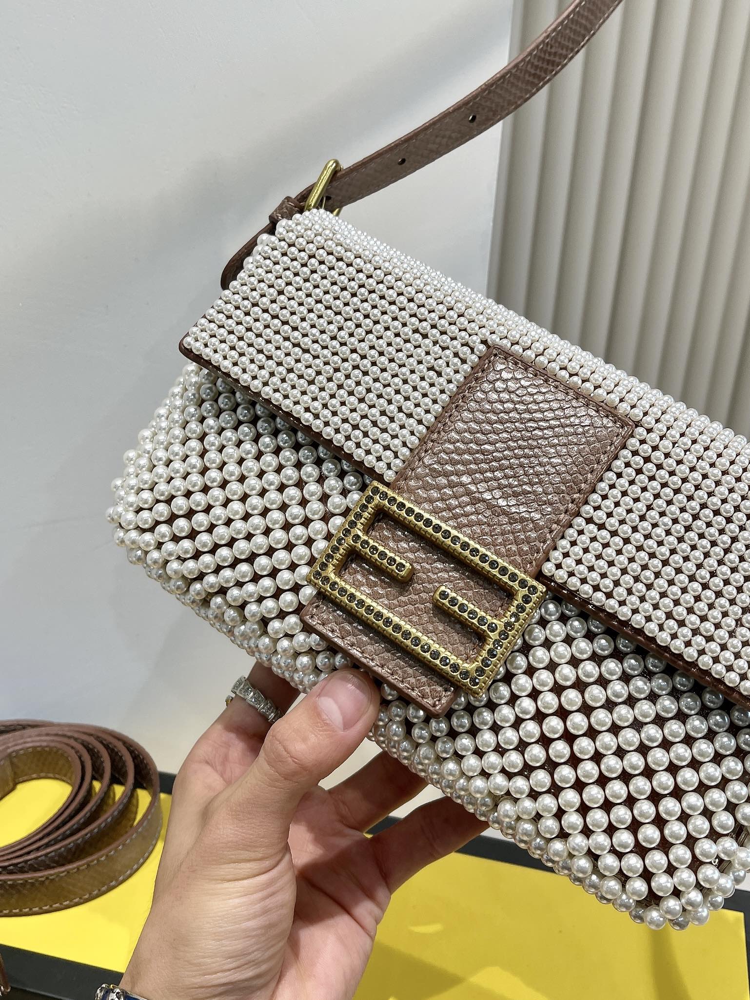 Elegant Textured Weave Baguette Shoulder Bag with Gold-Tone Buckle - Cream and Black