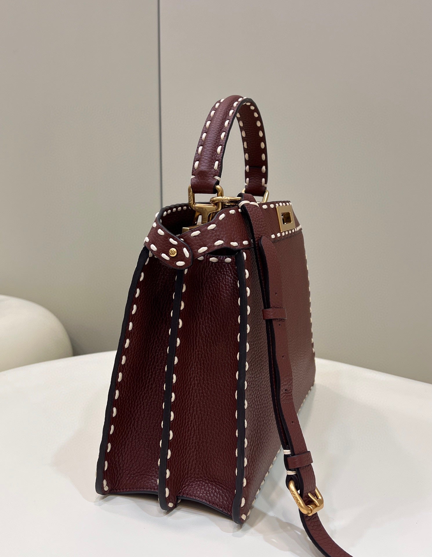 Sophisticated Burgundy Top Handle Handbag with White Contrast Stitching and Matching Wallet