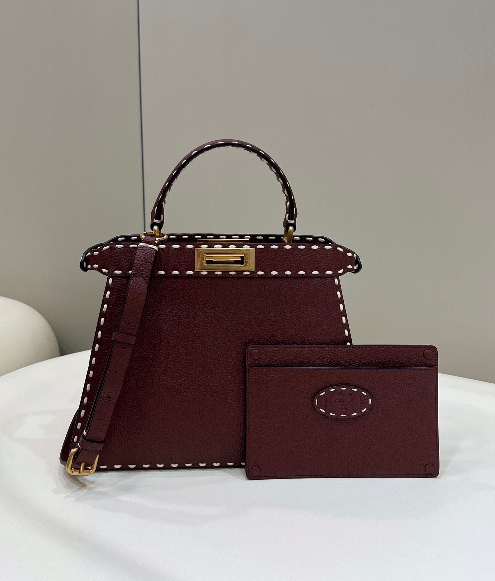 Sophisticated Burgundy Top Handle Handbag with White Contrast Stitching and Matching Wallet