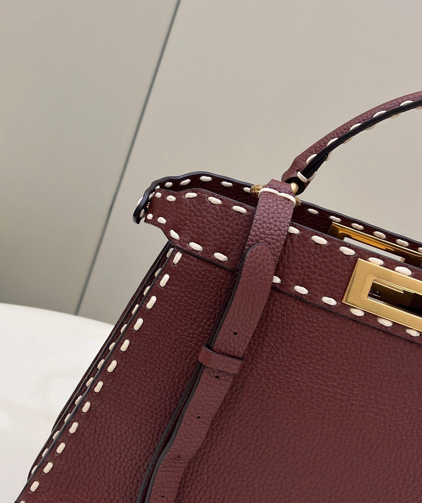 Sophisticated Burgundy Top Handle Handbag with White Contrast Stitching and Matching Wallet