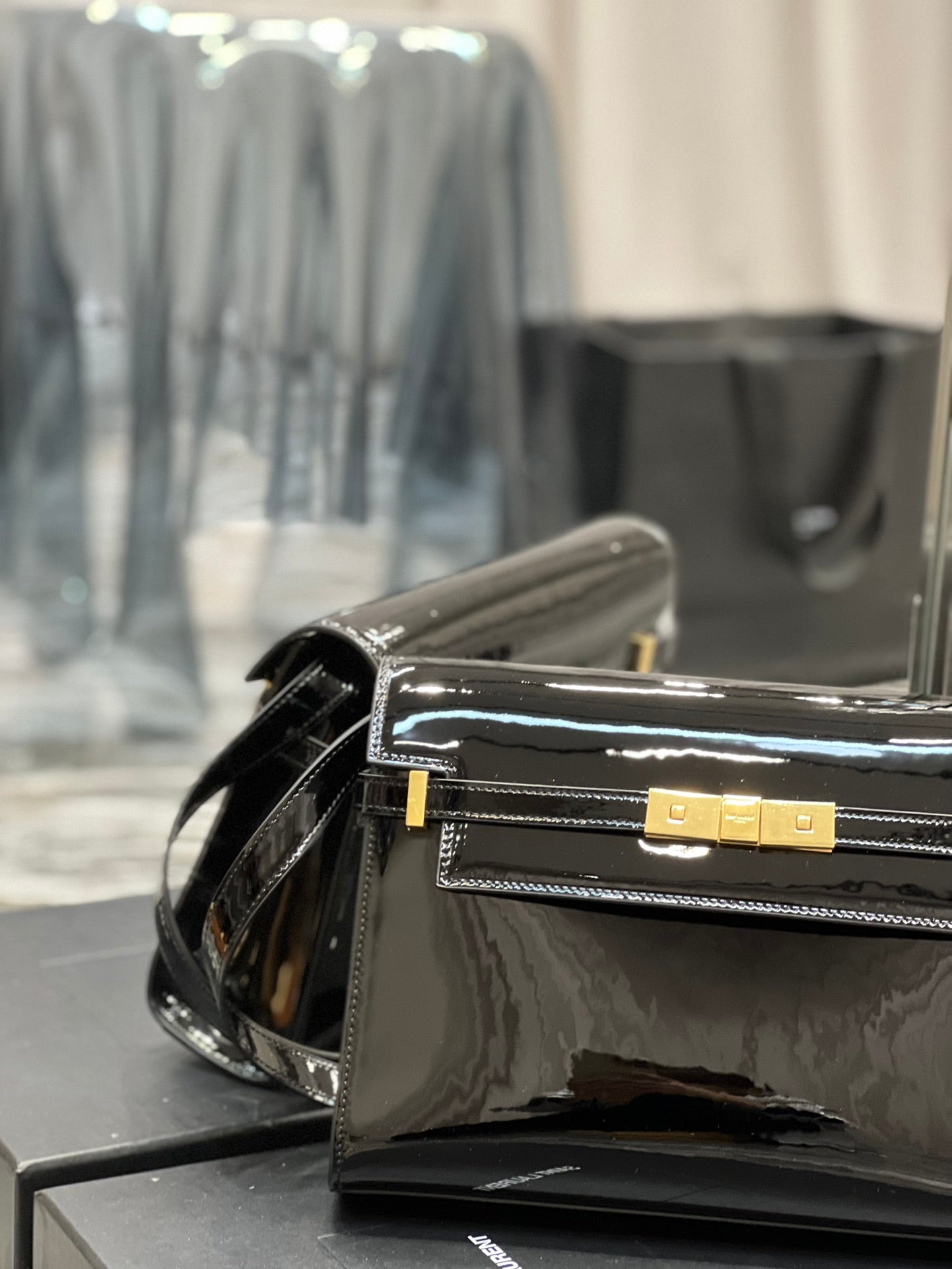 Elegant Black Patent Leather Handbag with Gold Clasp - Luxury Shoulder Bag
