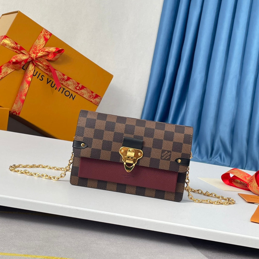 Louis Vuitton Brown Checkered Crossbody Bag with Gold Chain and Red Accent