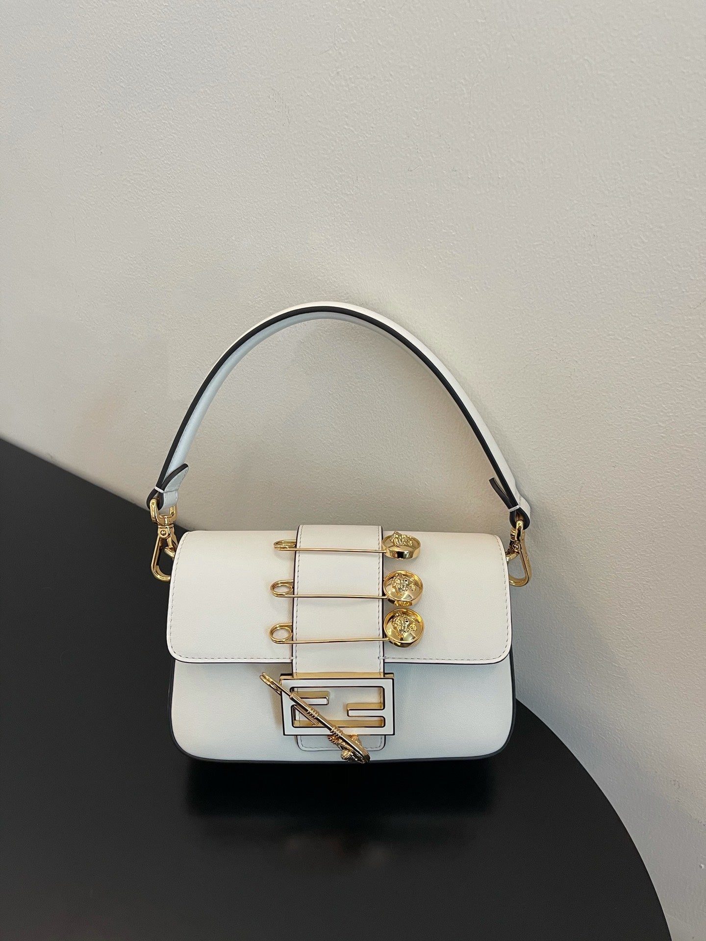 Elegant White Leather Mini Bag with Gold Flower Safety Pin Details