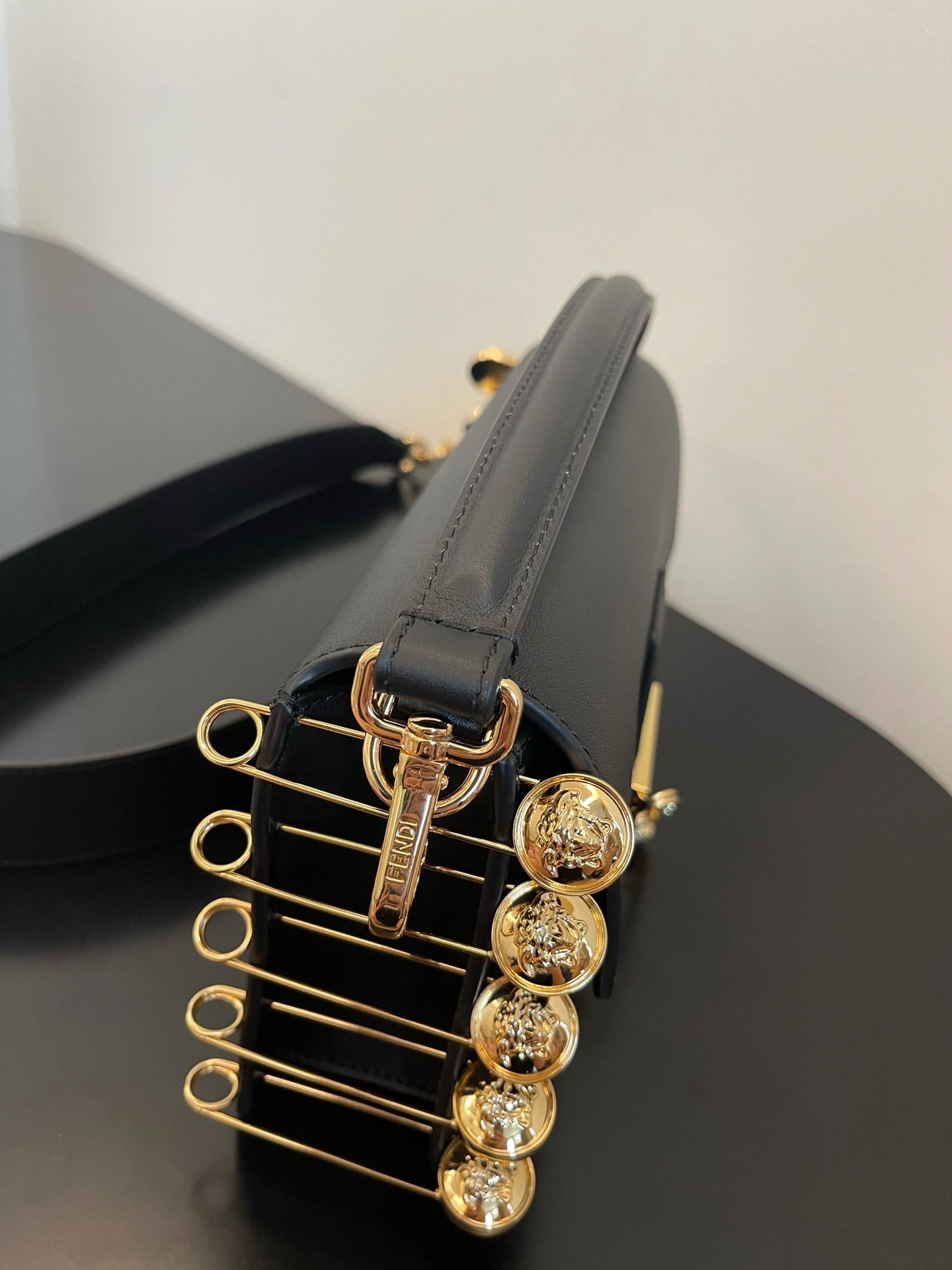 Black Leather Shoulder Bag with Gold Safety Pin Detail &amp; Studded Accents