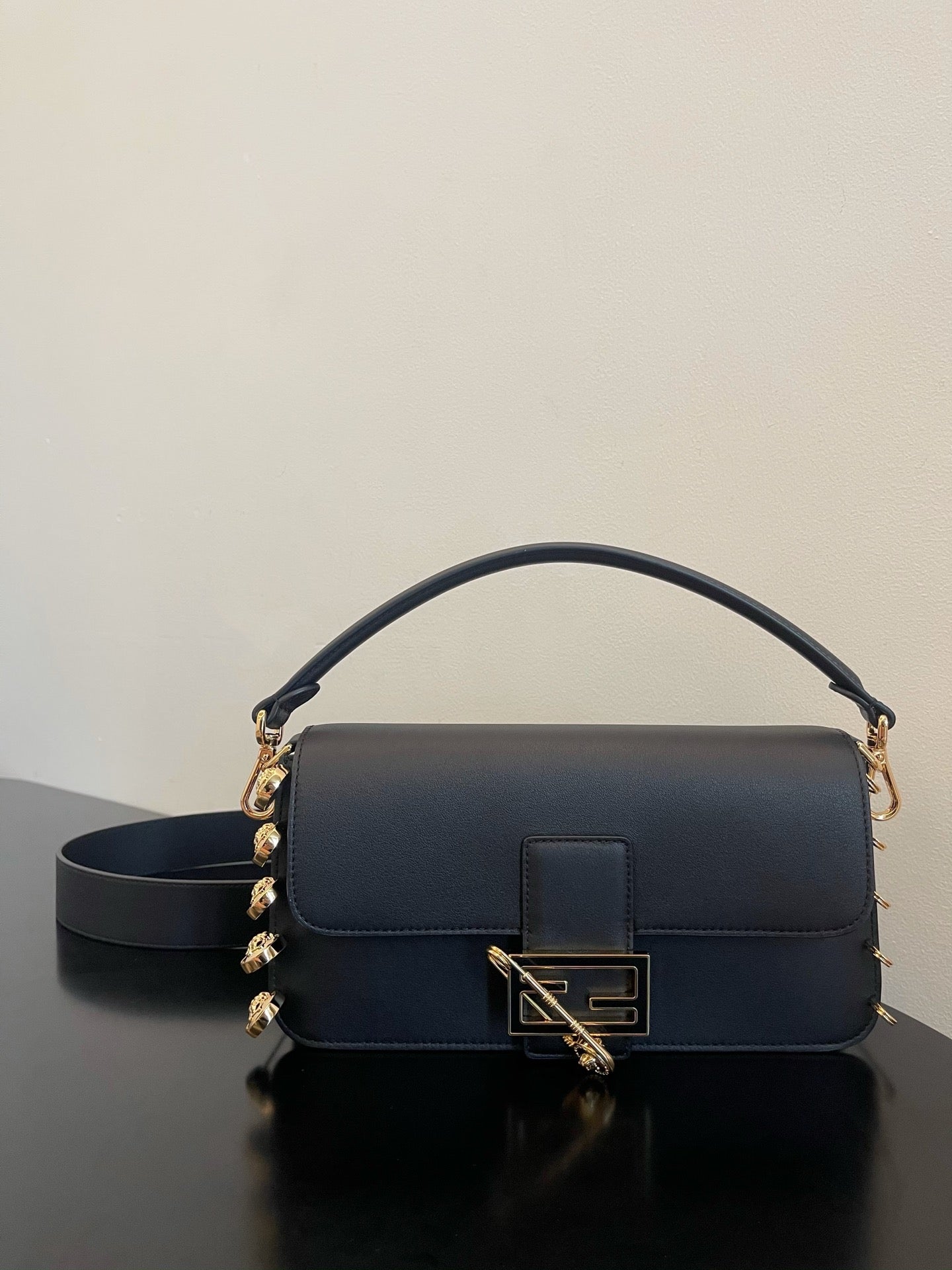 Black Leather Shoulder Bag with Gold Safety Pin Detail &amp; Studded Accents