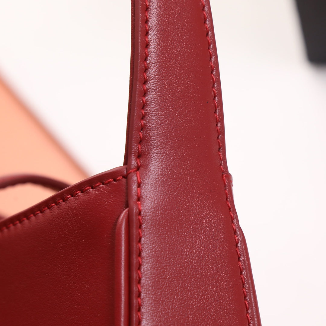 Red Textured Leather Accessory Detail - Stitched Mounting Loop