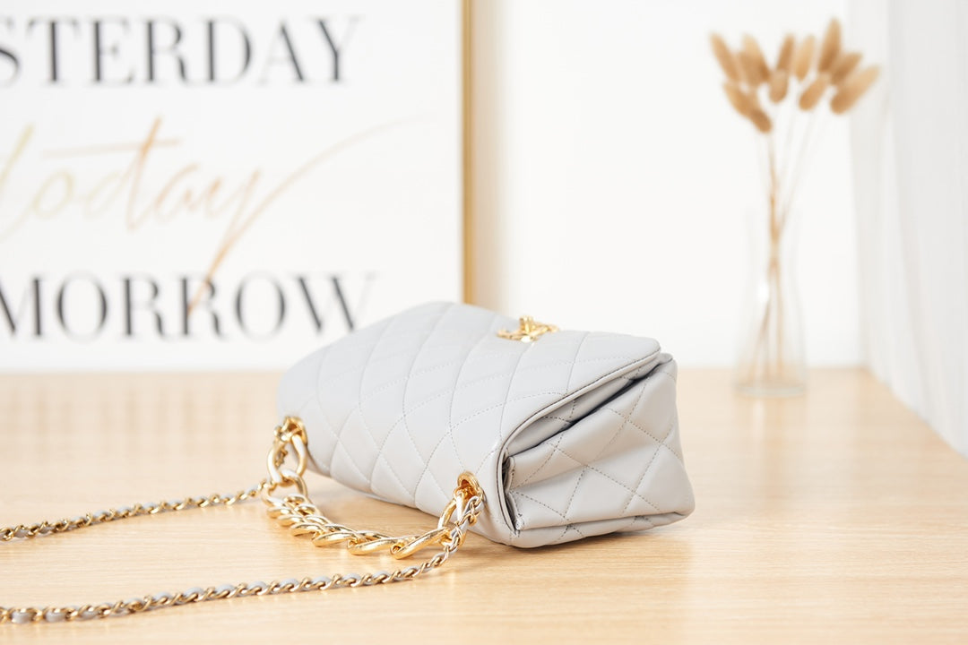 Light Blue Quilted Shoulder Bag with Gold Chain Strap and Chunky Link Hardware