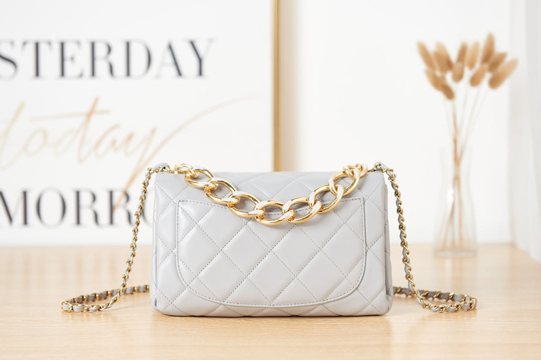 Light Blue Quilted Shoulder Bag with Gold Chain Strap and Chunky Link Hardware