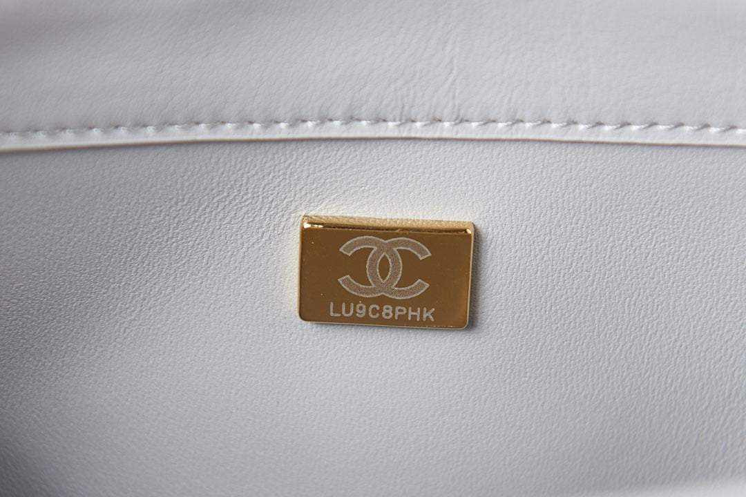 Light Blue Quilted Shoulder Bag with Gold Chain Strap and Chunky Link Hardware