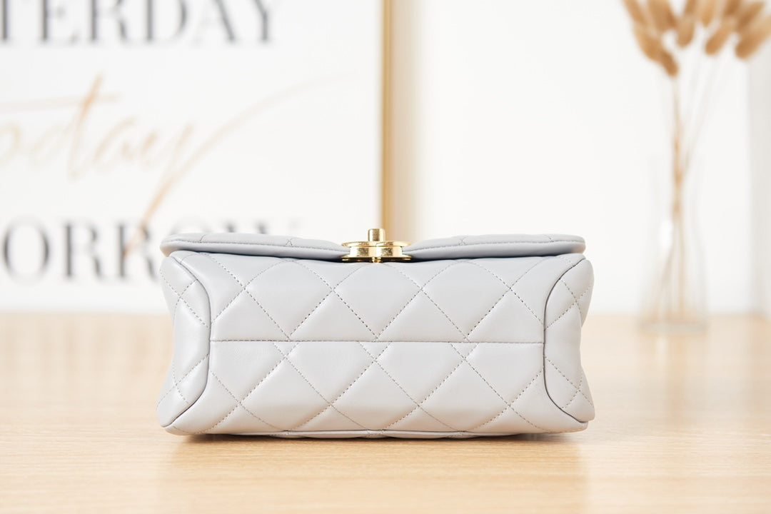 Light Blue Quilted Shoulder Bag with Gold Chain Strap and Chunky Link Hardware