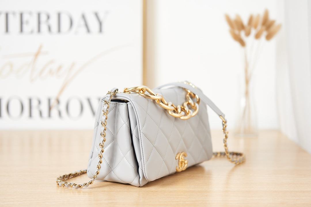 Light Blue Quilted Shoulder Bag with Gold Chain Strap and Chunky Link Hardware