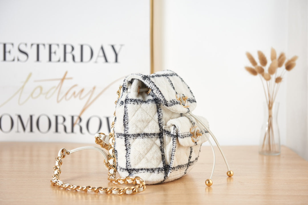 Elegant White and Black Quilted Tweed Mini Backpack with Gold Chain Straps