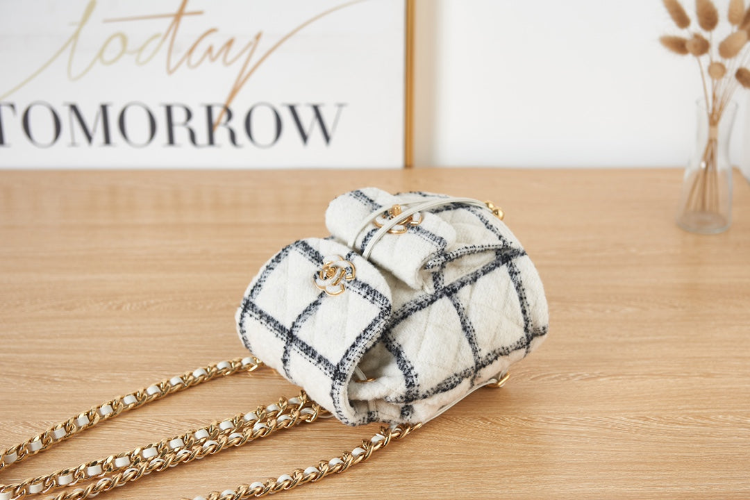 Elegant White and Black Quilted Tweed Mini Backpack with Gold Chain Straps