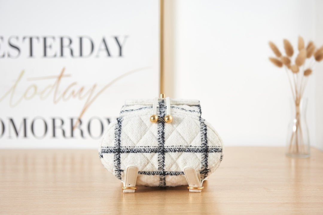 Elegant White and Black Quilted Tweed Mini Backpack with Gold Chain Straps