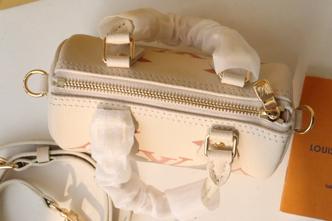 Louis Vuitton Nano Speedy Monogram Empreinte Leather Handbag - Cream/Pink