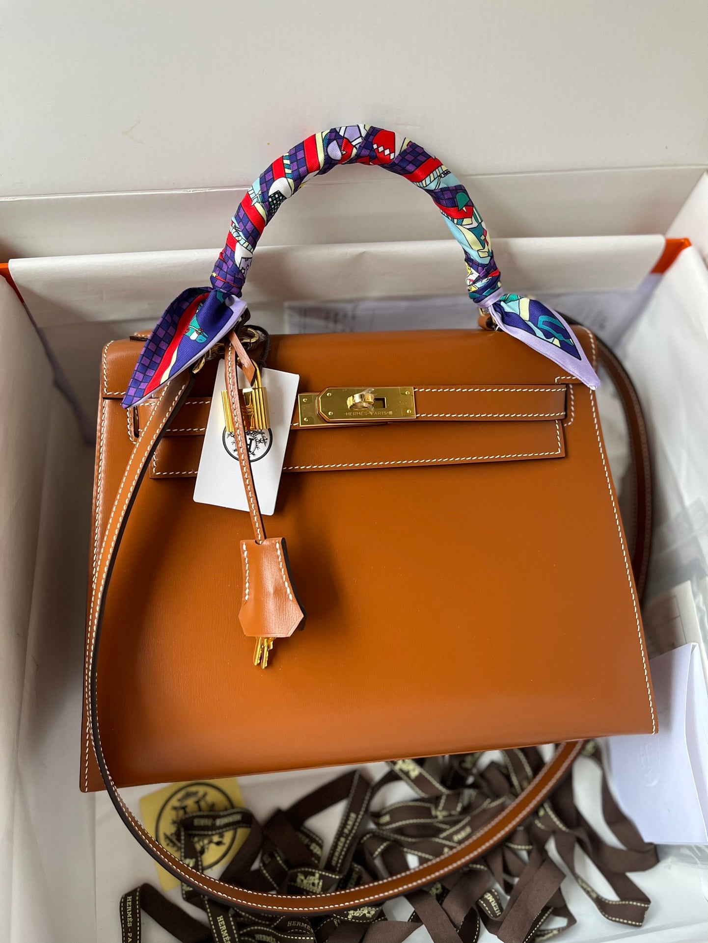 Hermès Kelly Bag Gold Leather with Gold Hardware and Twilly Scarf