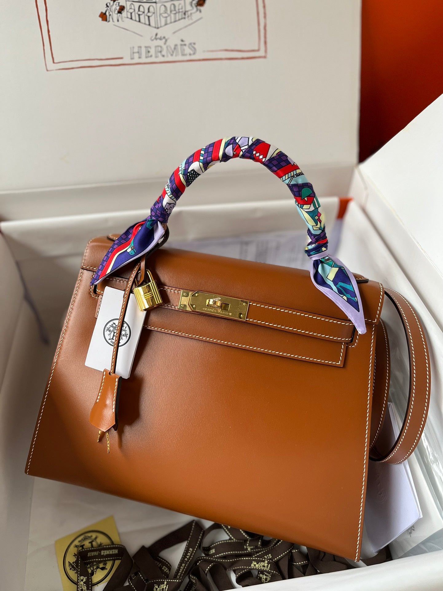 Hermès Kelly Bag Gold Leather with Gold Hardware and Twilly Scarf